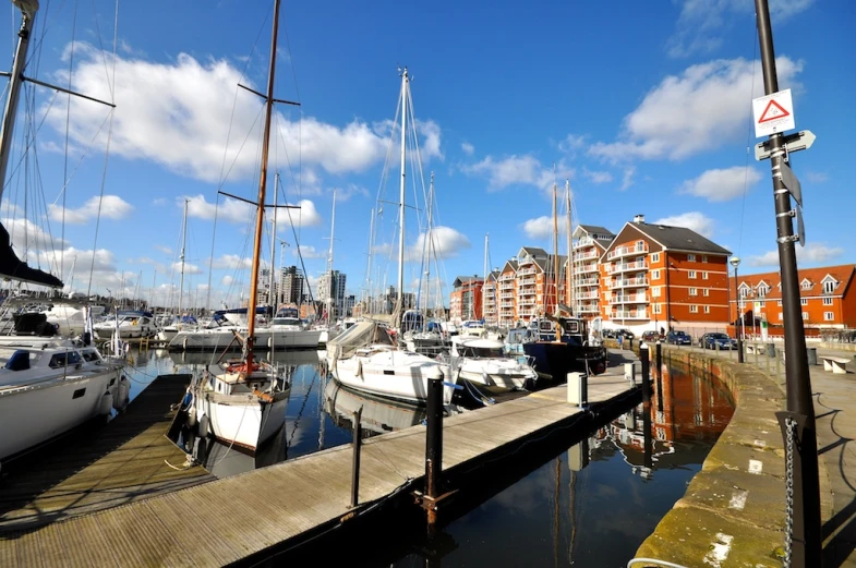 some boats that are sitting by some docks