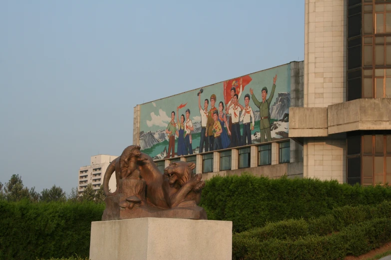 statues of people in front of a building