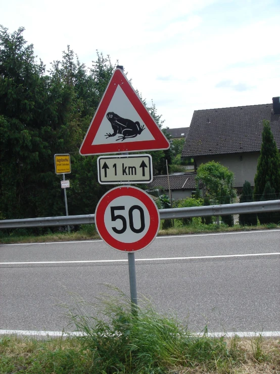 a street sign that reads, speed limit ahead