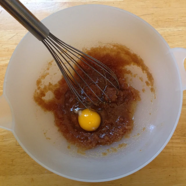 a bowl with some food in it and two eggs in the bowl