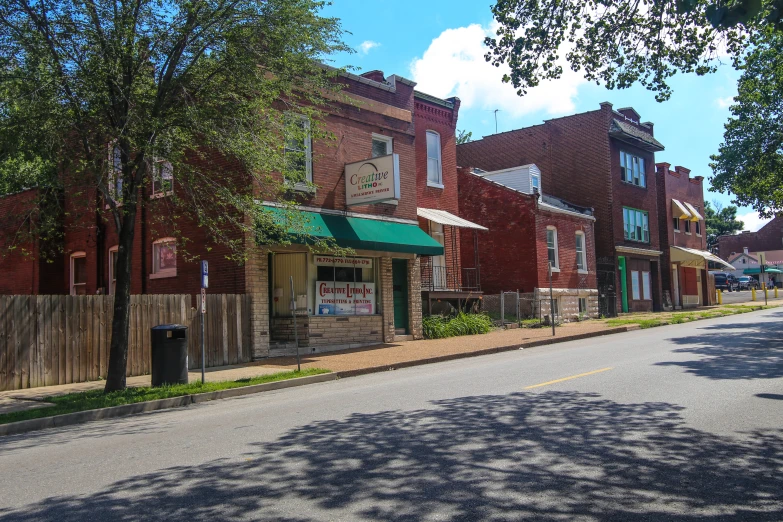 a street with several small brick buildings on the side