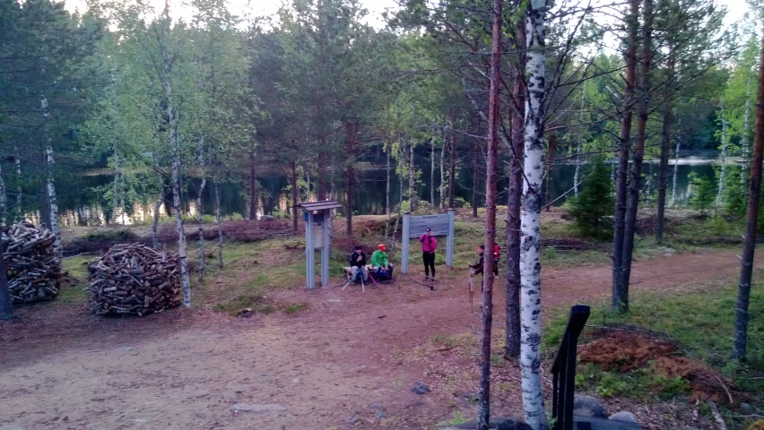 a trail with some people and trees