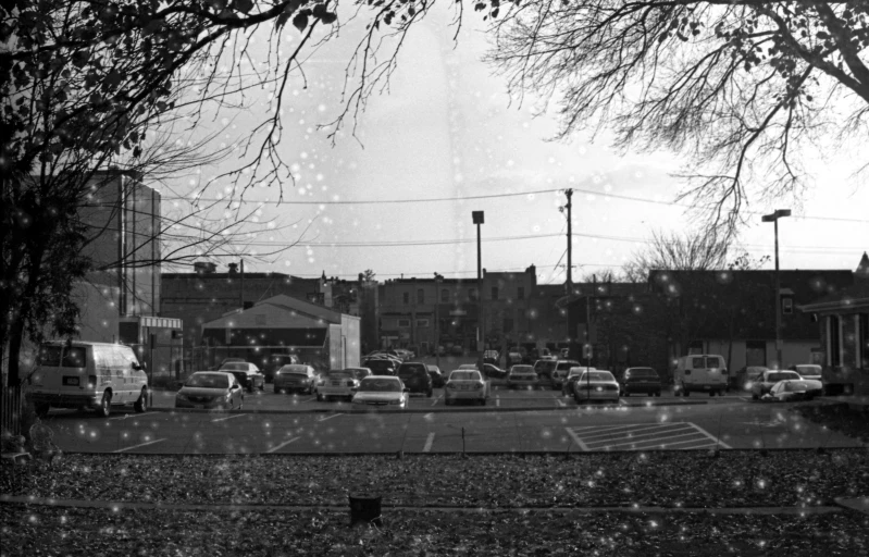 a city with lots of traffic and people on the sidewalk