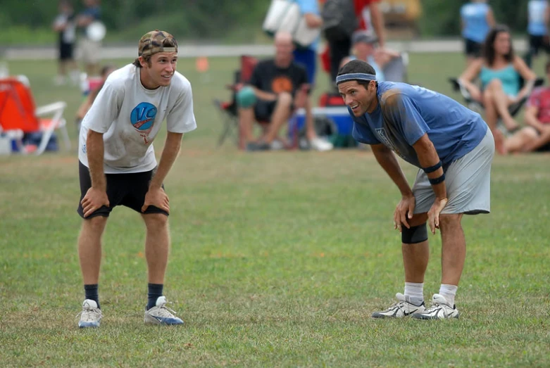 a couple of men are on a field