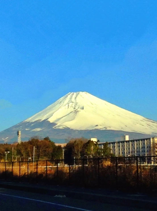 the mountain on top of a high - rise in an area of fenced land