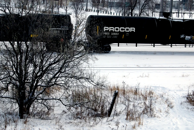 a train is traveling on a snowy train track