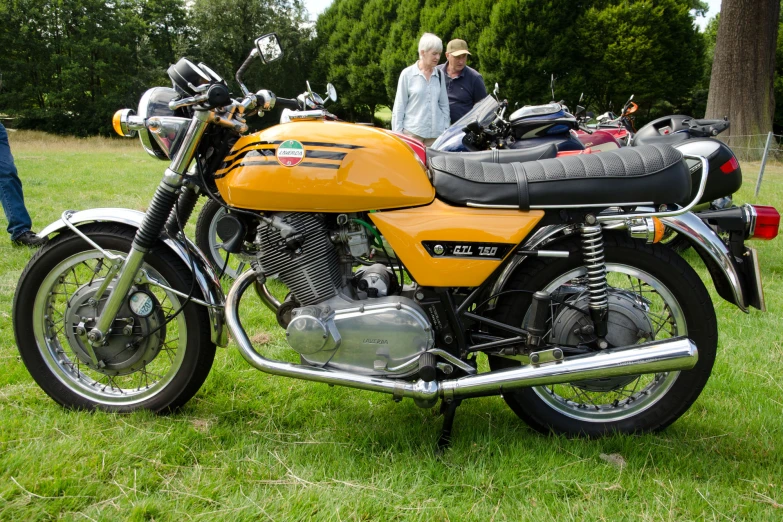 the motorcycle is orange and black in color