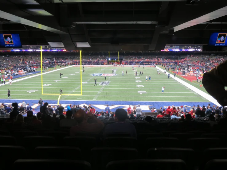 a football field with many people in the stands