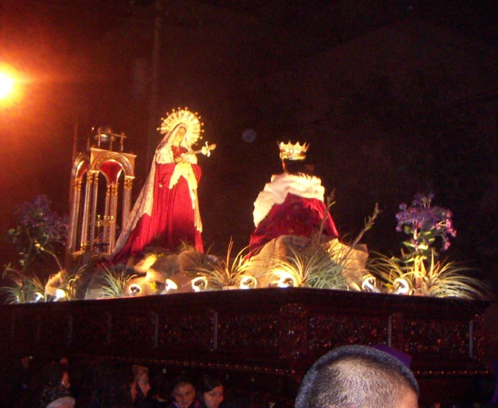 two floats decorated with flowers and lights and lights