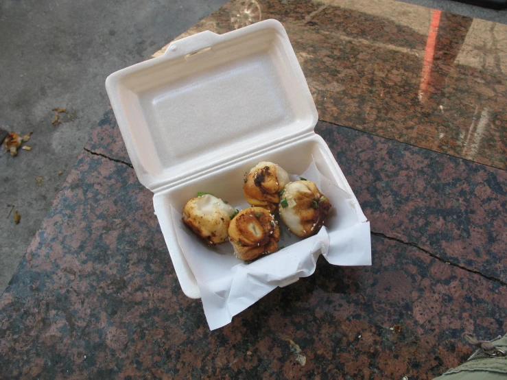 a small lunch box on a ground outside