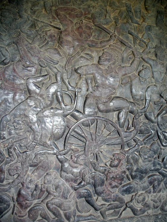 the pattern on the surface shows various animals, and people