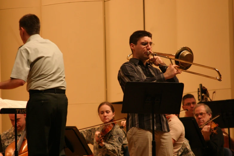 a man playing trumpet in a orchestra