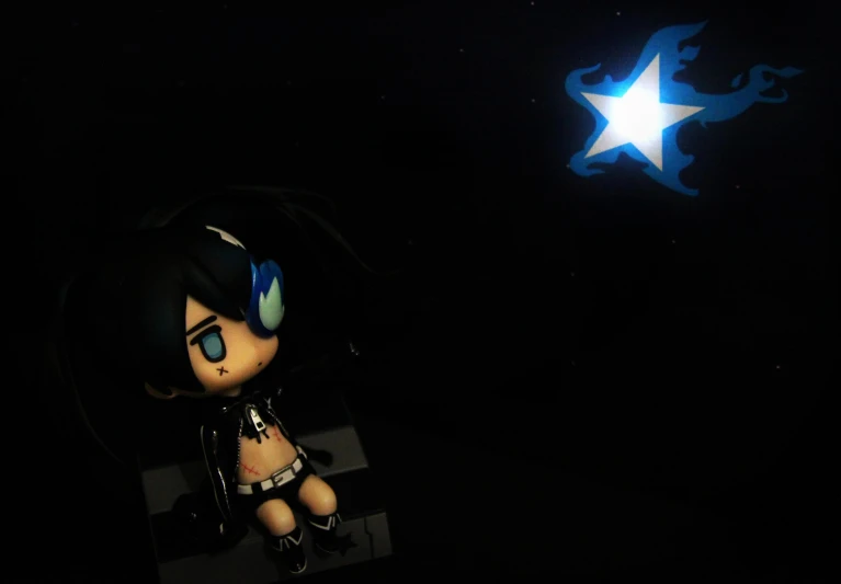 a stuffed animal star shines through the dark