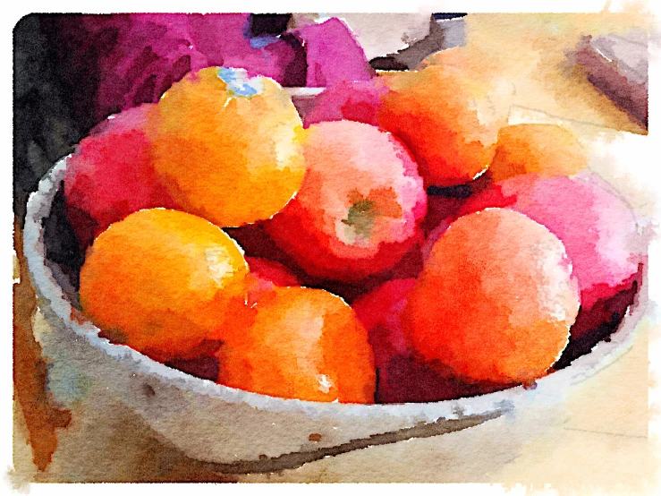 a white bowl filled with oranges on top of a wooden table