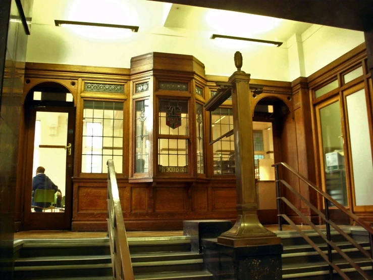 the building is made up with wooden paneling and two clocks