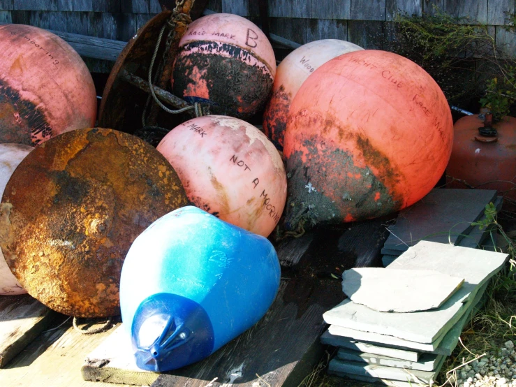 various colored plastic objects in a fenced in area