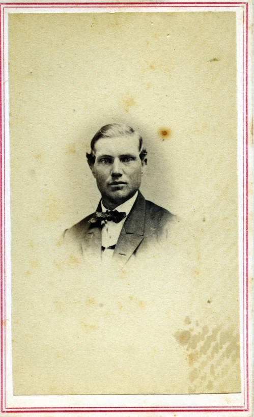 a vintage portrait of a man with a bow tie