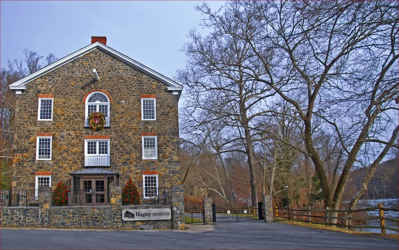 the front entrance of a stone brick building