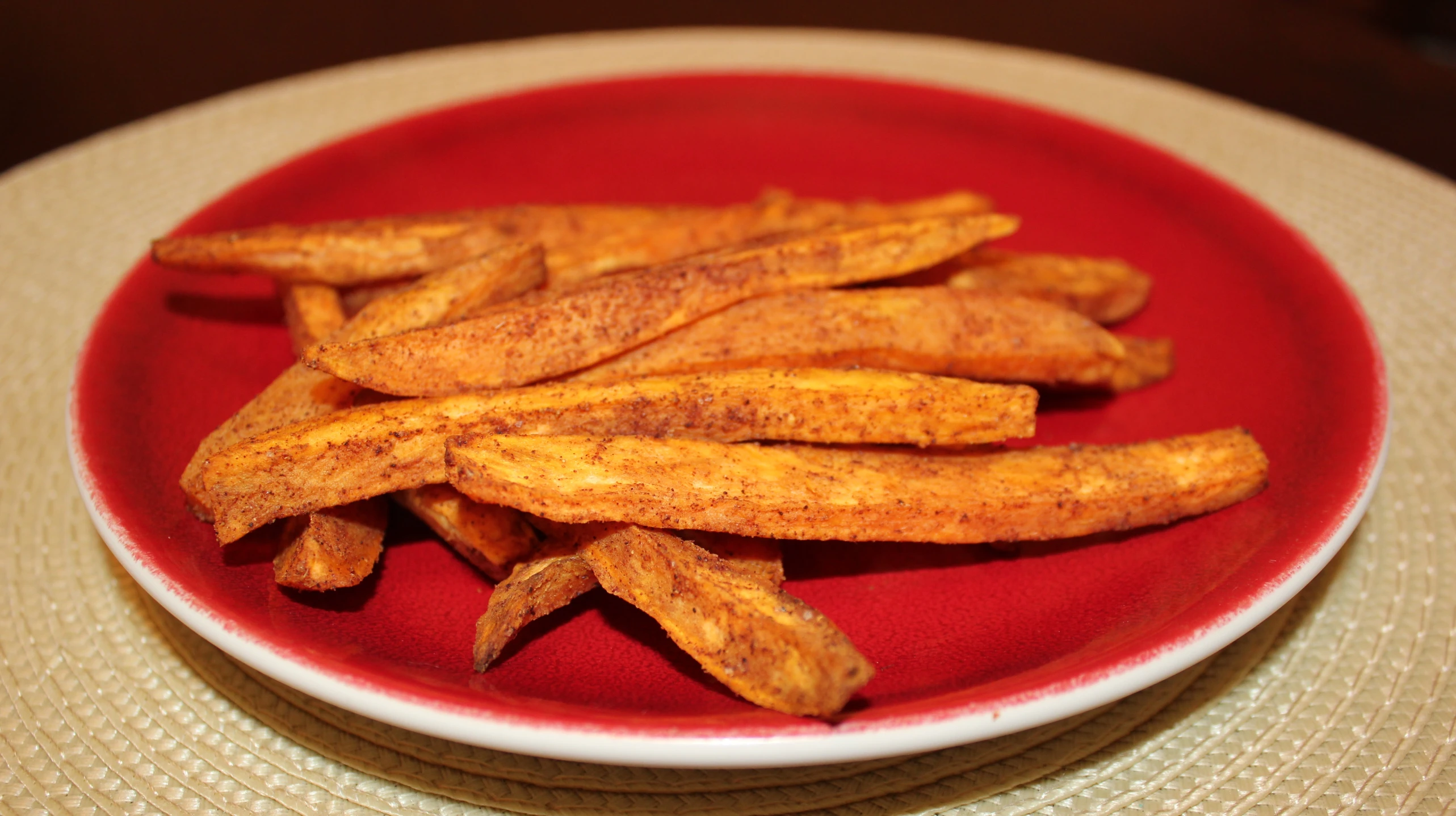 there is some cooked fries on a plate