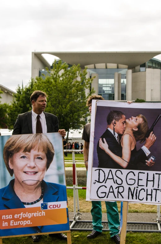 people holding signs and pictures of different countries