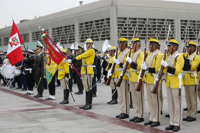 a group of uniformed men and women are standing