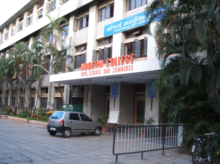 a vehicle that is parked in front of a building