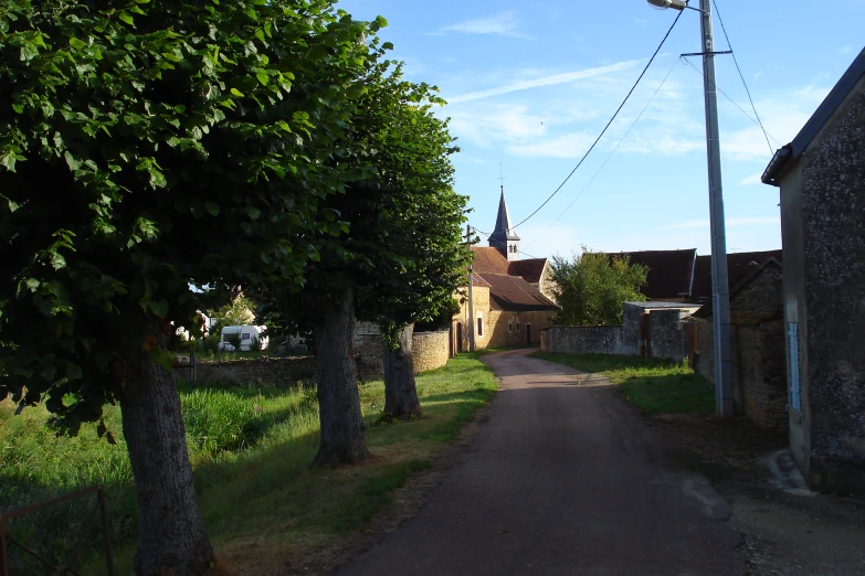 a rural lane near a church in a small village