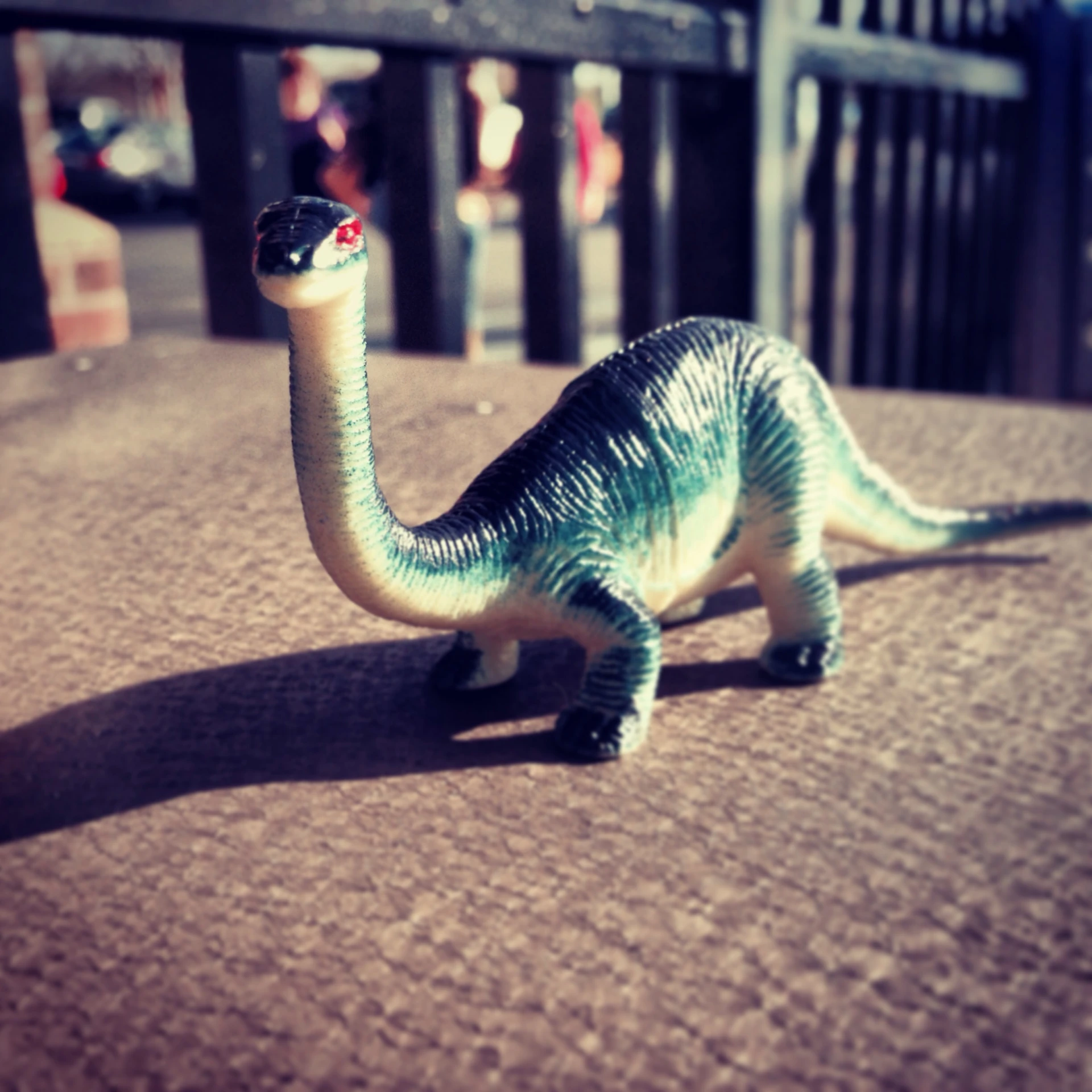 an old toy toy dinosaur is on the ground