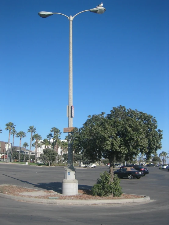 an intersection with traffic lights and a light pole