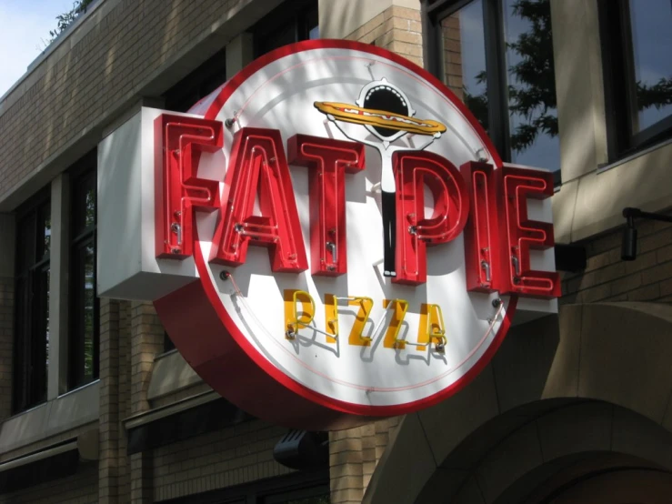 a large white and red sign that says fat pep pizza