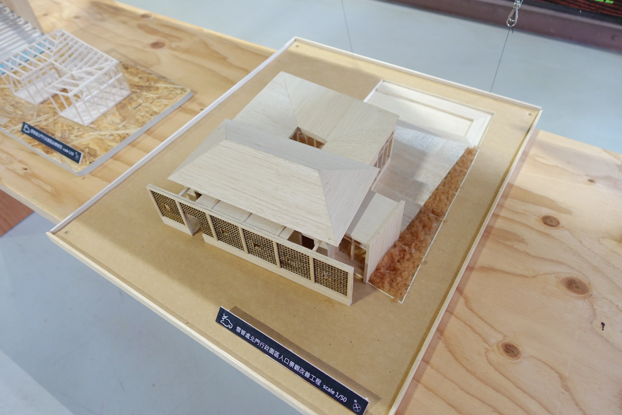 there is a paper model of a house on display