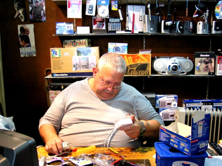 a man looks at the paper he is holding