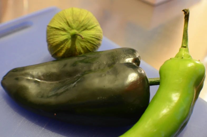 green peppers with a half a lime on the side