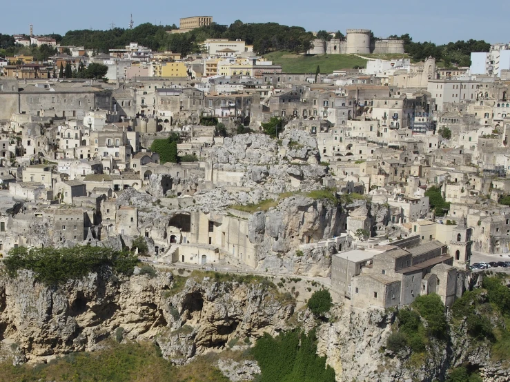 a very tall group of buildings on the hillside