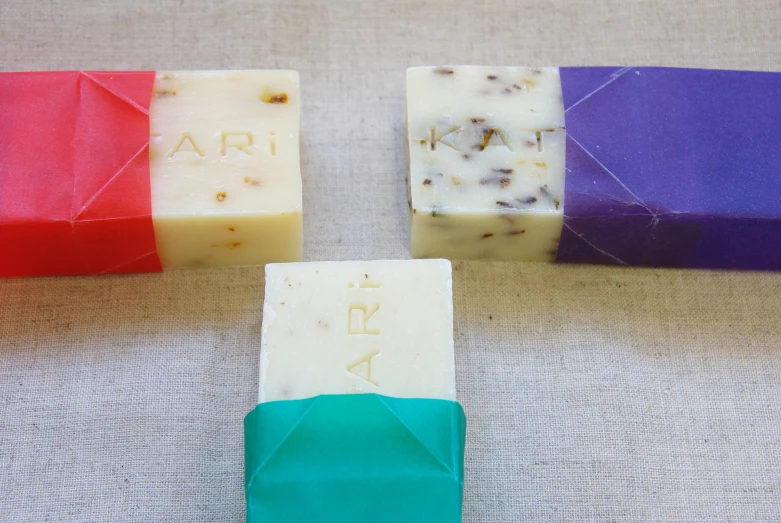 several bars of soaps are sitting on a table