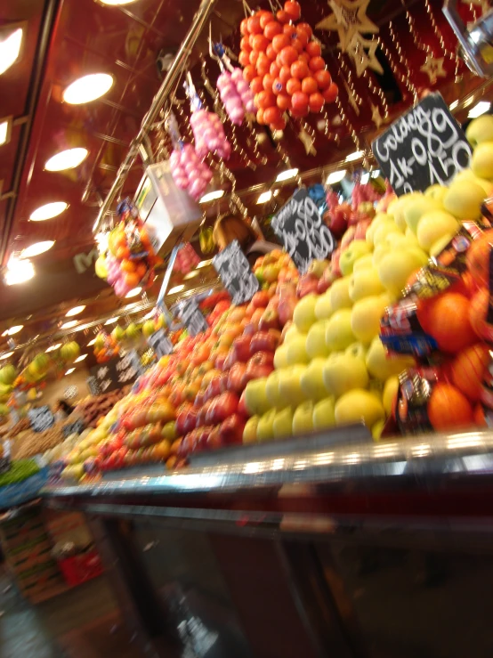 a display in a grocery store filled with lots of colorful fruit