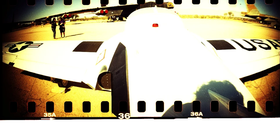 a polaroid pograph of a white propeller plane