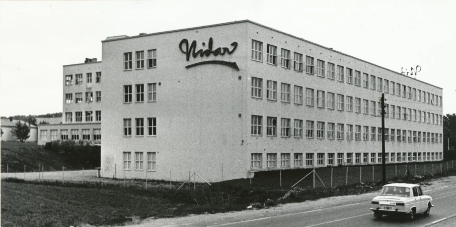 the cars are driving through the large building