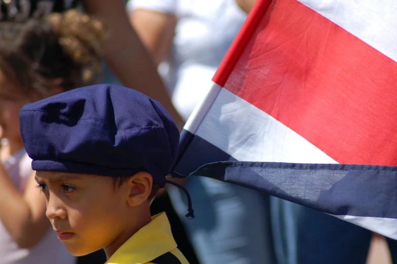 a boy with an american flag on his head