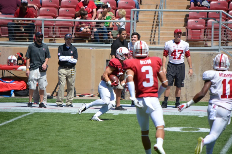 a football player running with a ball during a game