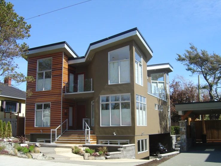 a two story house is on a suburban street