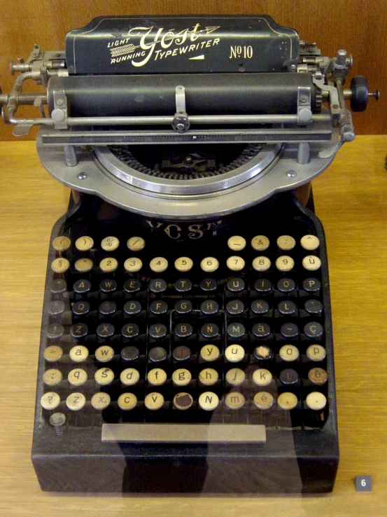 a antique typewriter on display on a table