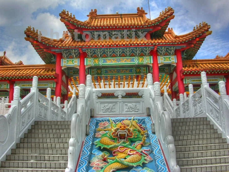 a chinese building with stairs and roof decorated in oriental art