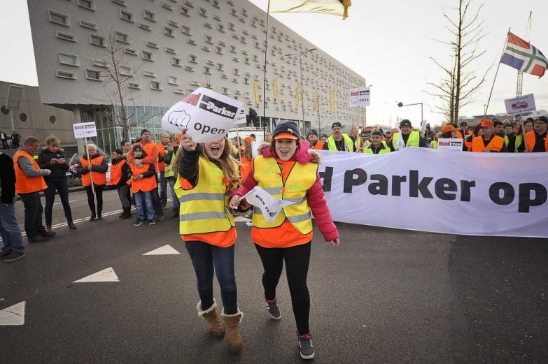 two women walk together at a protest