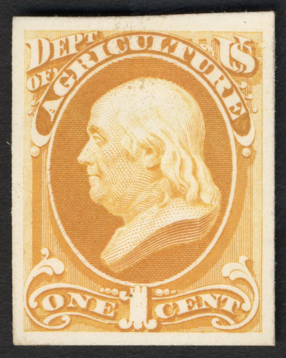 an orange and yellow stamp with a face