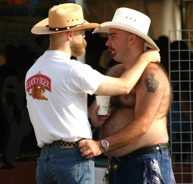 men in hats emcing each other outside