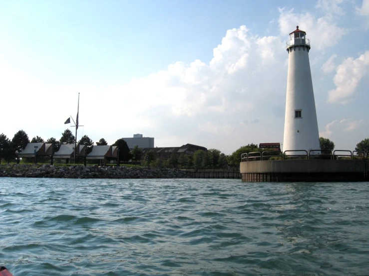 a large white light house on top of a pier