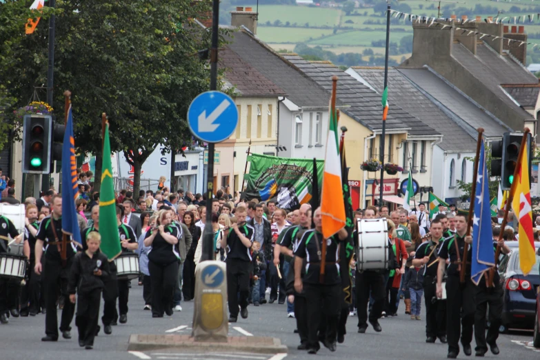 a group of people marching down the street