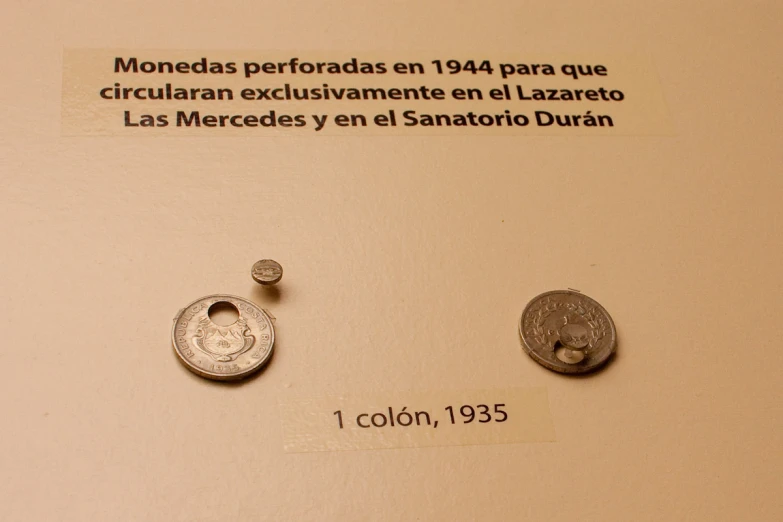 several different types of coins are displayed on a wall