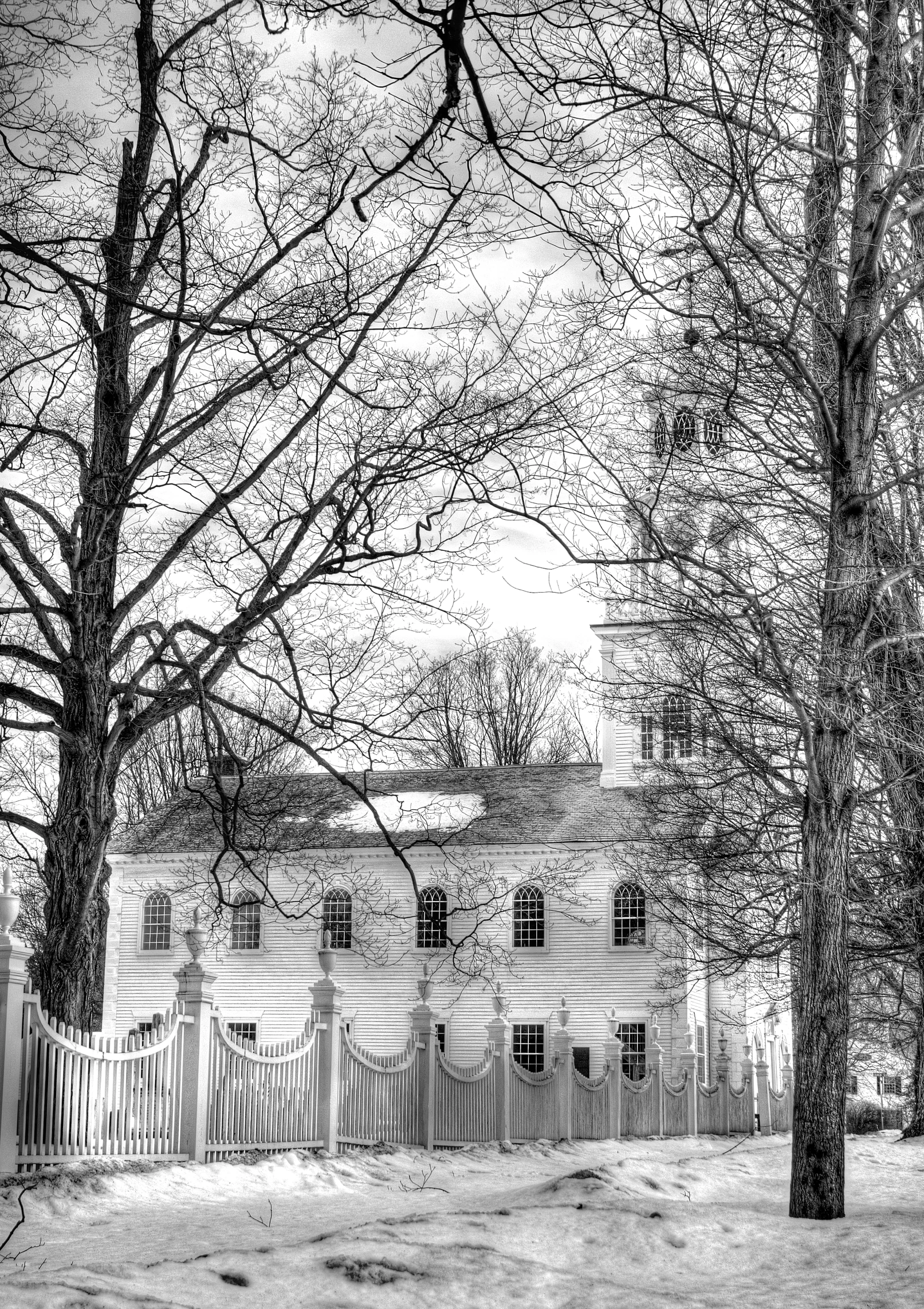 a big house that is by some trees